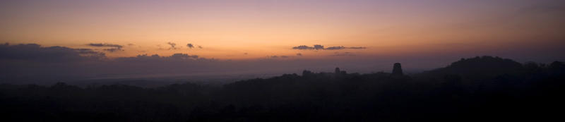 Panoramic images of the sun setting over the World Heritage Mayan Temple ruins at Tikal, Guatemala.